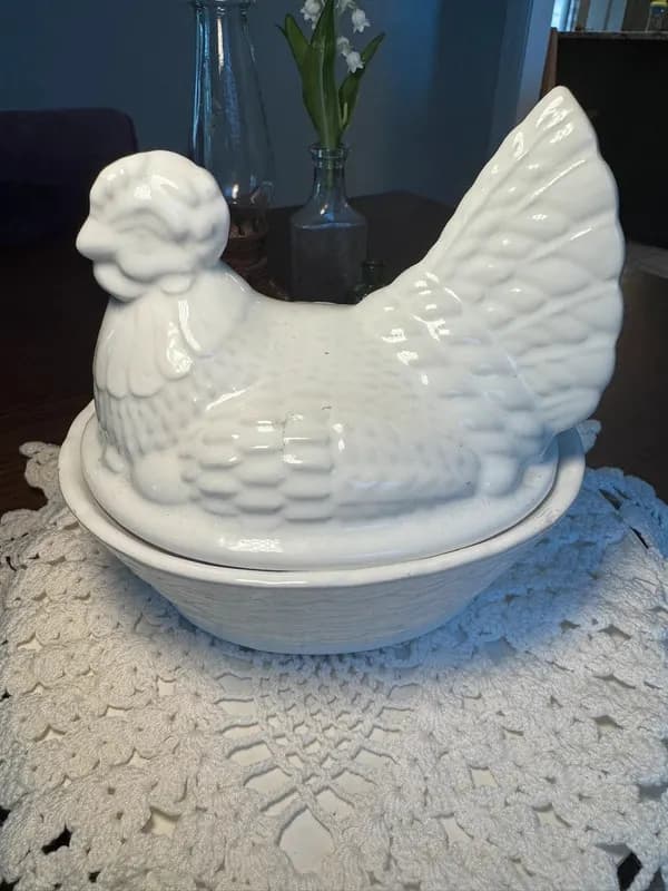 White ceramic hen on nest covered dish